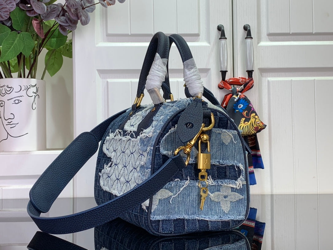Louis Vuitton denim blue crossbody tote with patterned panels, top handles and strap