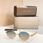 Bvlgari round sunglasses with gold-tone frame and light blue tinted lenses