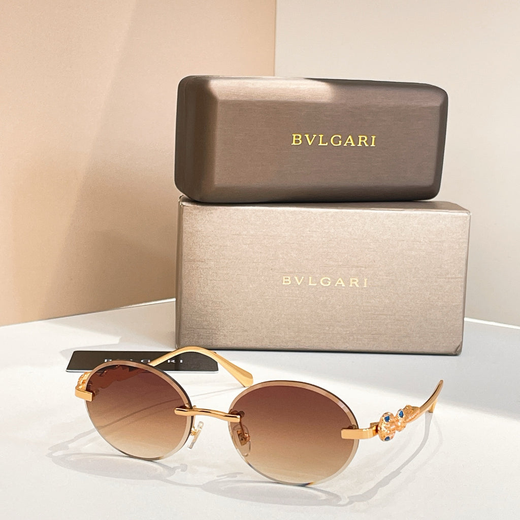 Bvlgari round sunglasses with gold-tone frame and amber-brown tinted lenses
