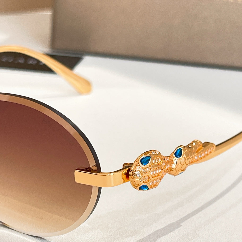 Bvlgari sunglasses with gold-tone temple detail and blue gemstone-like accents