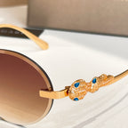Bvlgari sunglasses with gold-tone temple detail and blue gemstone-like accents