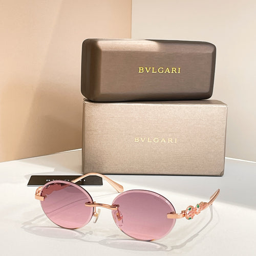Bvlgari round sunglasses with gold-tone frame and rose-pink tinted lenses