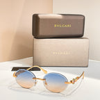 Bvlgari round sunglasses with gold-tone frame and blue tinted lenses