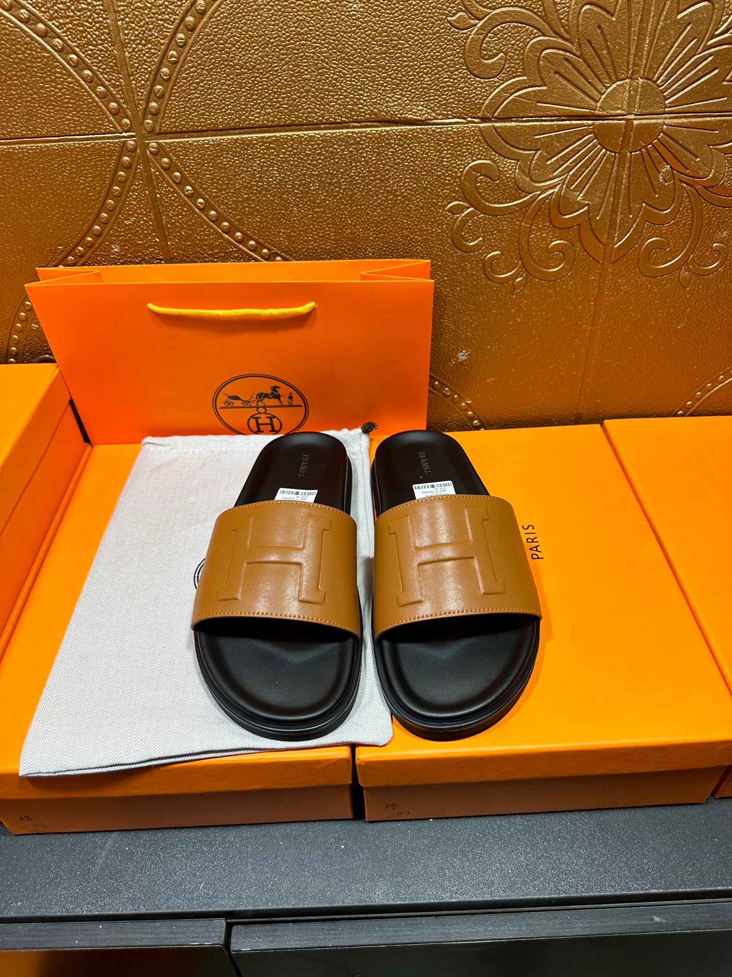 Hermes slide sandals with tan leather strap and black rubber footbed, set of two