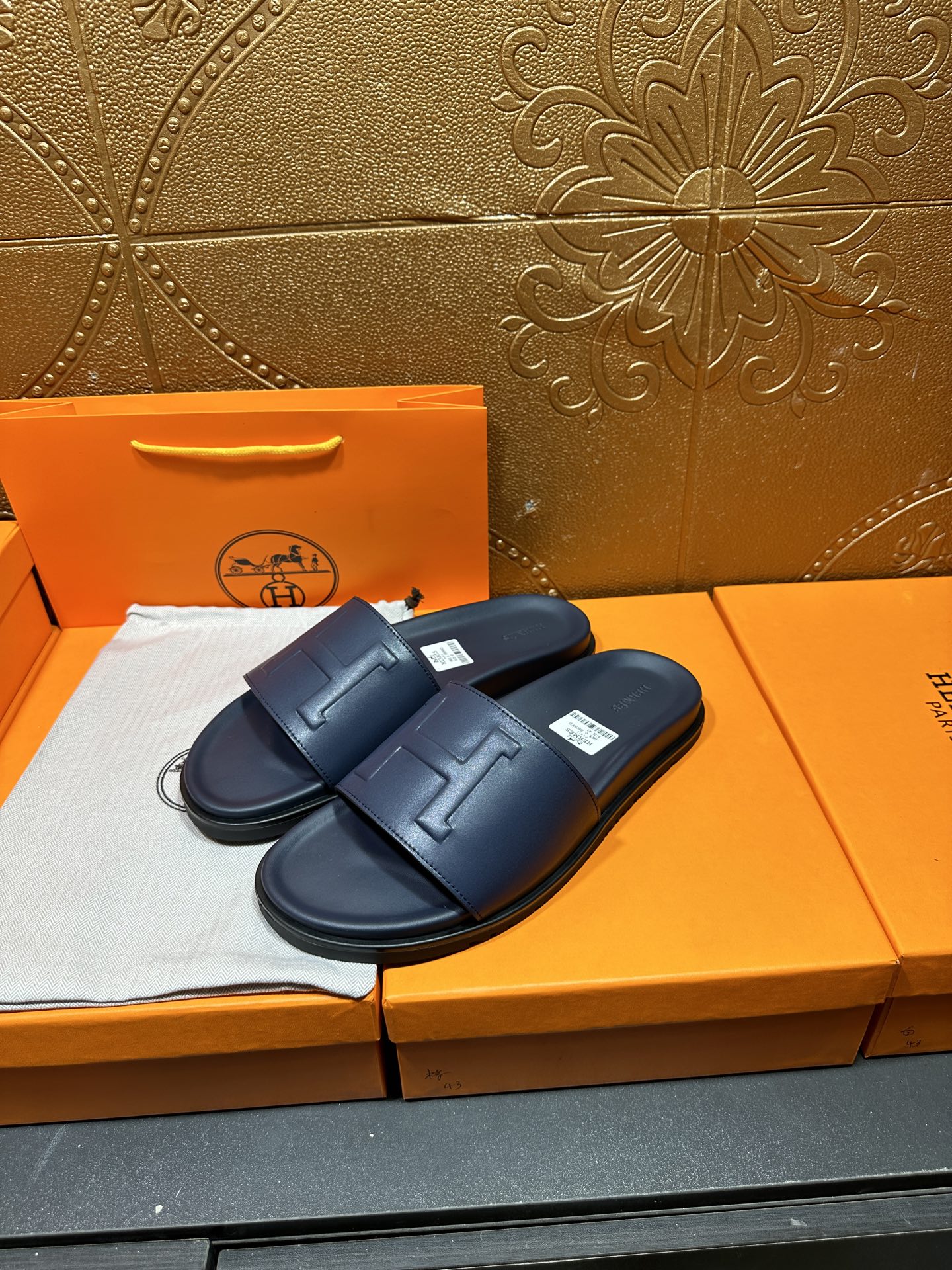 Hermes navy slide sandals with cushioned sole and wide front strap