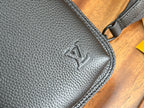 Louis Vuitton men's crossbody bag close-up of textured leather with embossed logo