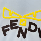 Long-sleeve sweatshirt front graphic detail: yellow outline bow and bold dark letters
