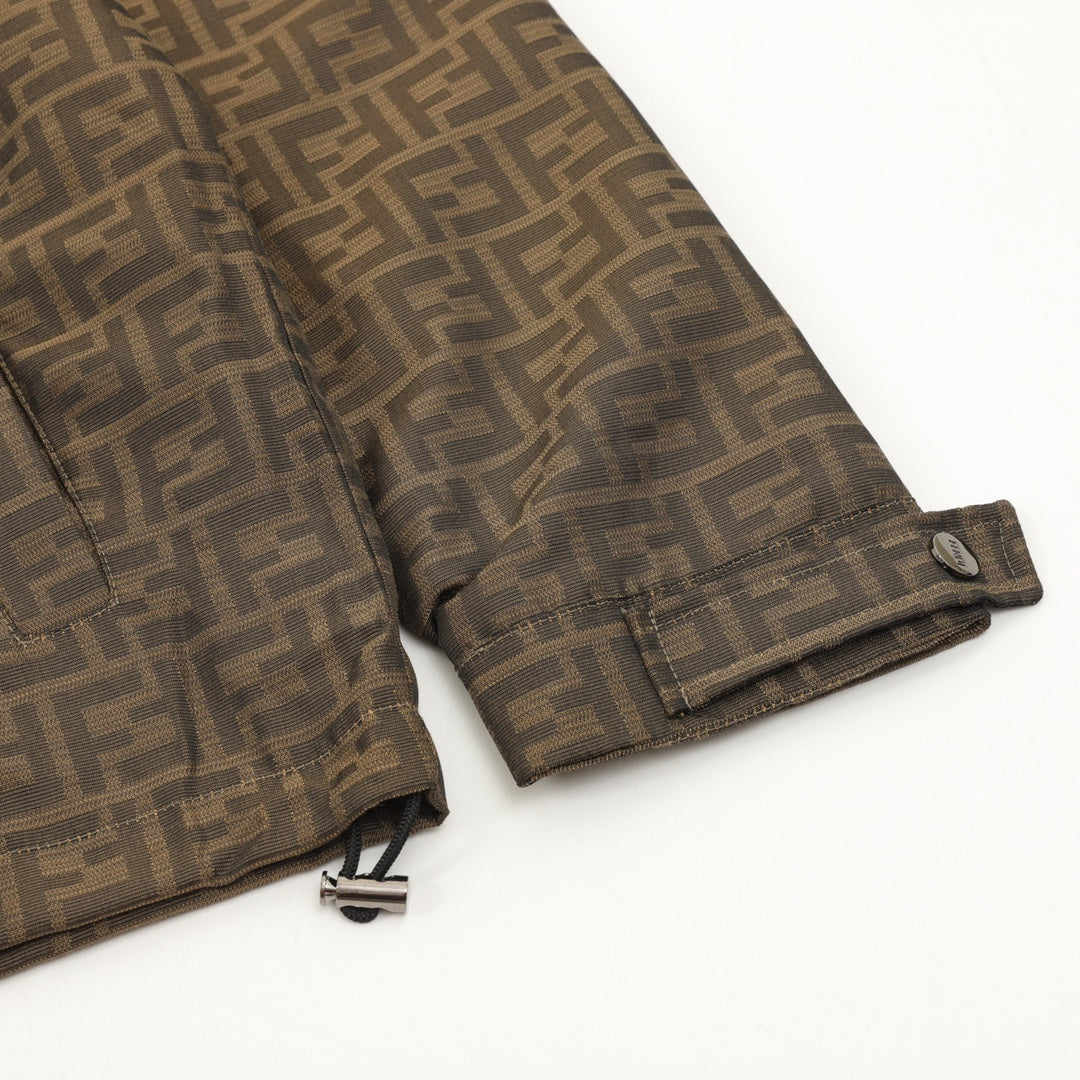 Brown FF hooded jacket sleeve cuff with snap strap and stitched hem.