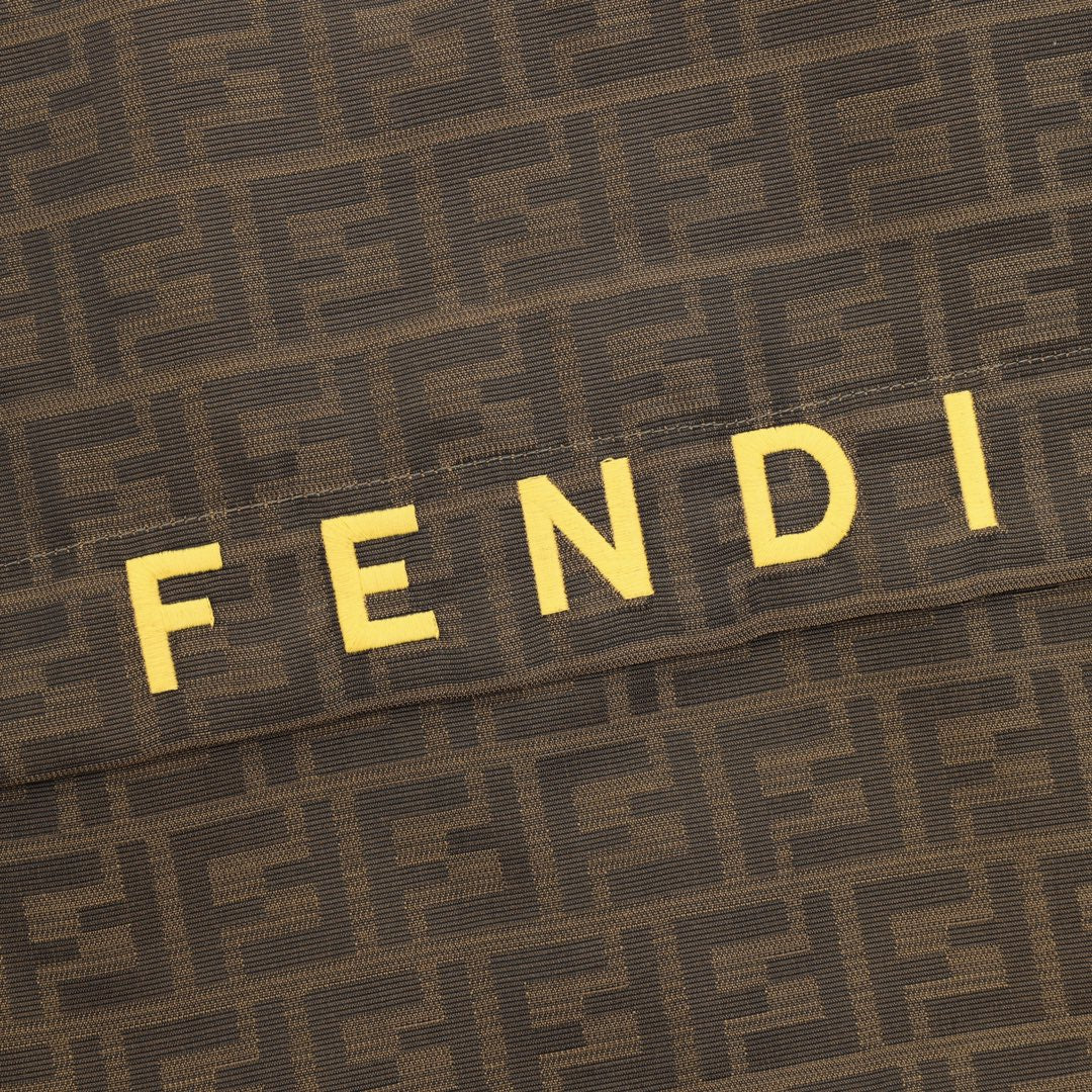 Brown FF hooded jacket chest shows yellow 'FENDI' lettering.