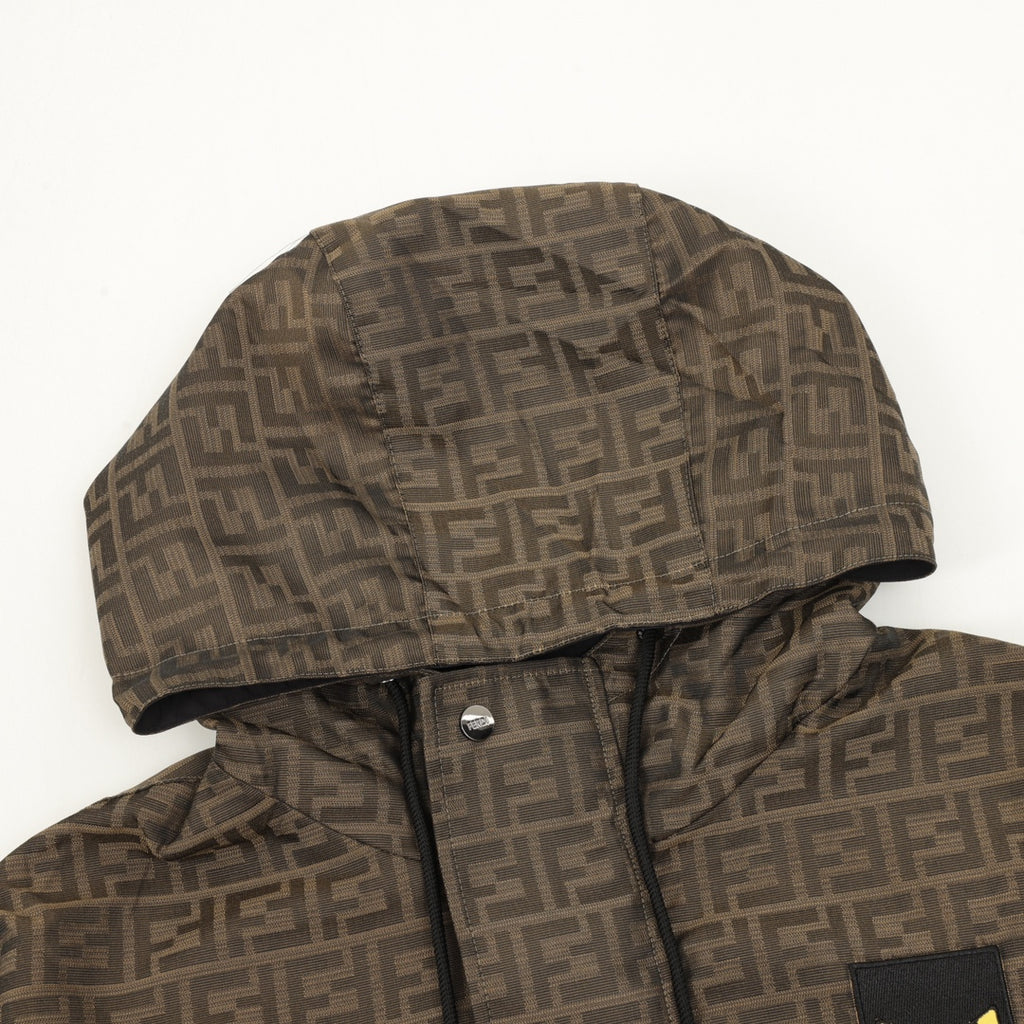 Brown Fendi hooded jacket close-up with FF pattern, hood lining and snap placket.