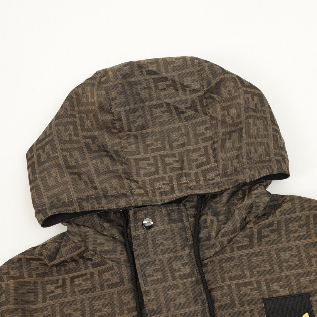 Brown Fendi hooded jacket close-up with FF pattern, hood lining and snap placket.