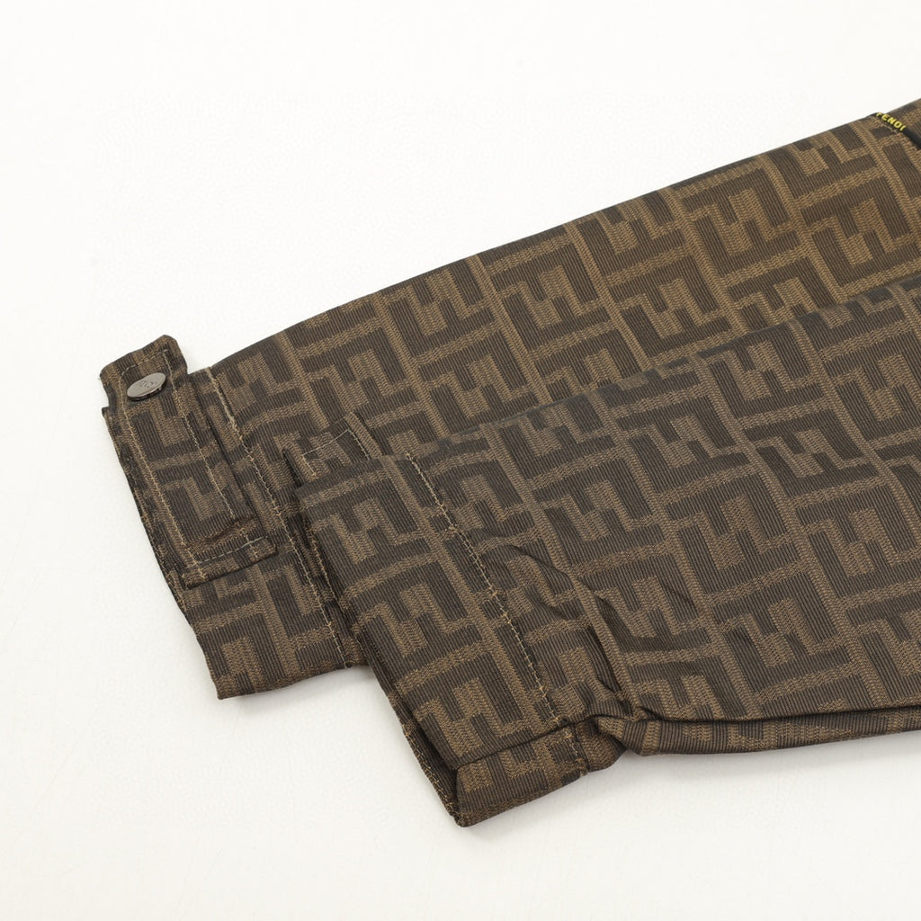 Brown FF hooded jacket bottom hem with drawcord, stitched edge and small snap tab.