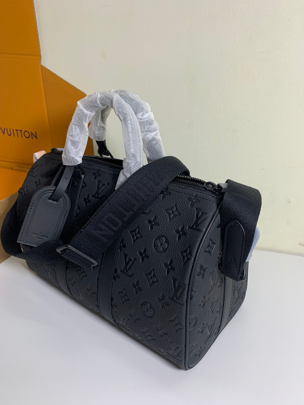 Louis Vuitton monogram duffel bag in dark gray/black with top handles and zip