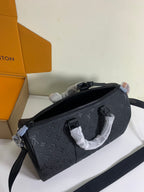 Louis Vuitton monogram crossbody bag in dark gray/black with zip top and strap