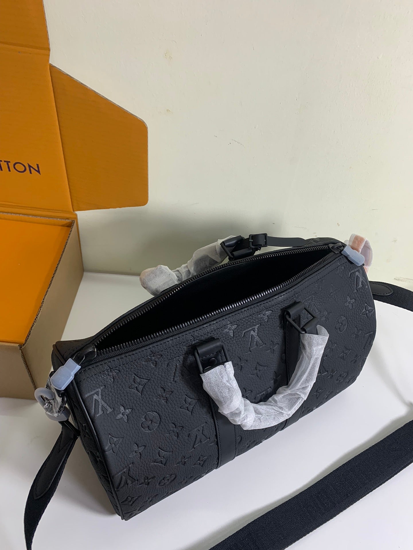 Louis Vuitton monogram crossbody bag in dark gray/black with zip top and strap