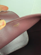 Celine burgundy leather strap with gold Celine Paris logo stamp