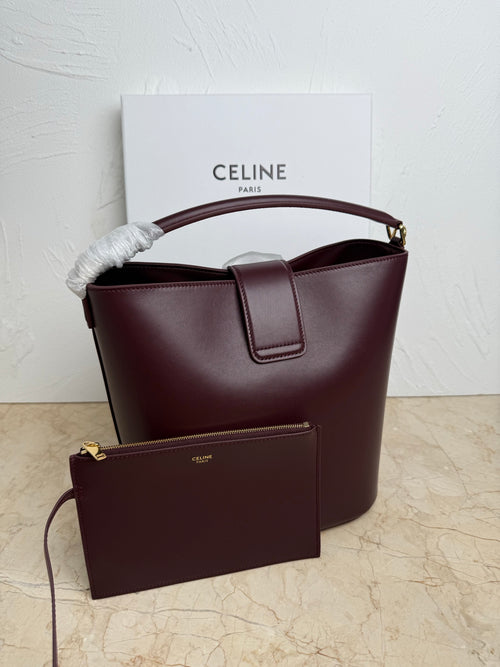 Celine burgundy leather bucket bag with snap front pocket and top handle