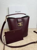 Celine burgundy leather bucket bag with top handle, strap, and front pouch