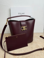 Celine burgundy leather bucket bag with top handle, strap, and front pouch