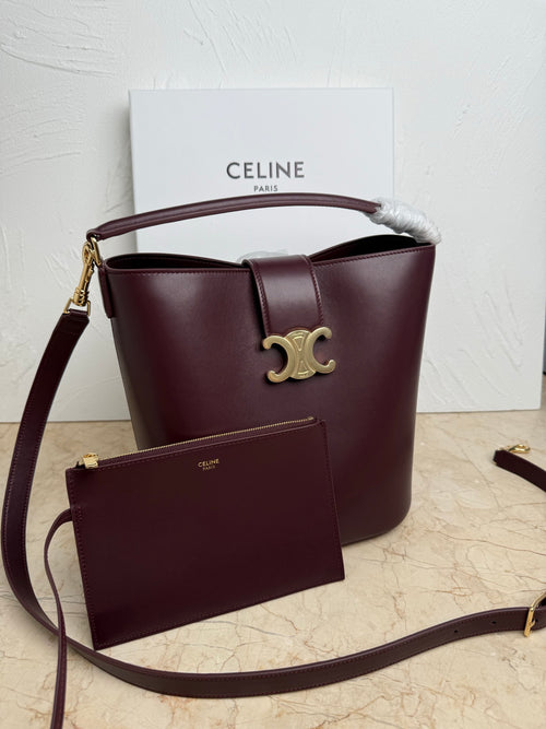 Celine burgundy leather bucket bag with top handle, strap, and front pouch
