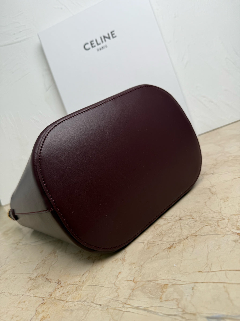 Celine burgundy leather bucket bag with rounded sides and shoulder strap