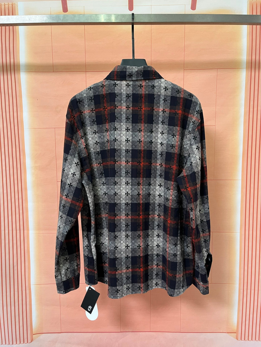 Long-sleeve shirt back view with dark plaid squares and floral pattern