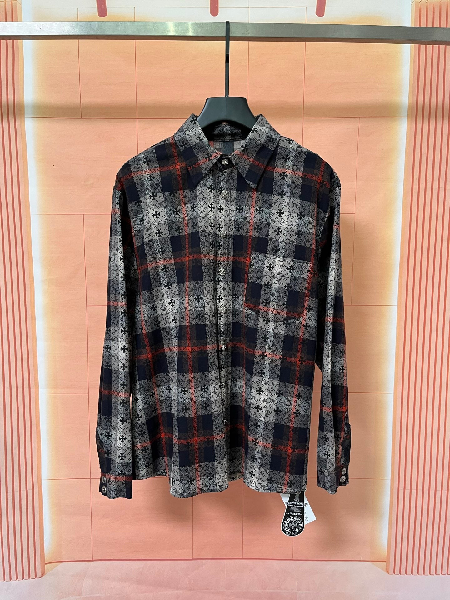 Long-sleeve button-up shirt with black, gray, and red plaid and floral print