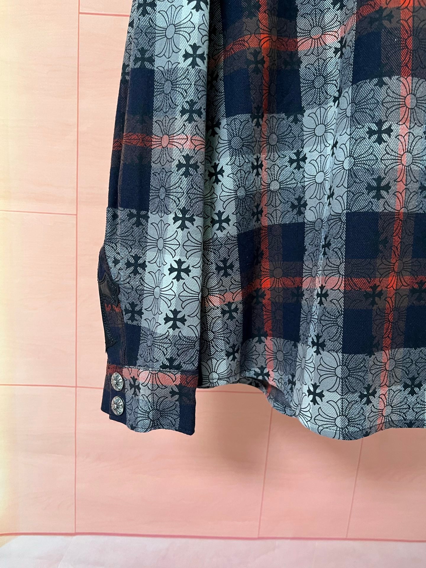 Shirt sleeve with buttoned cuff and plaid panel over floral print