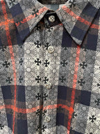 Shirt neckline detail with floral-and-plaid pattern and round button