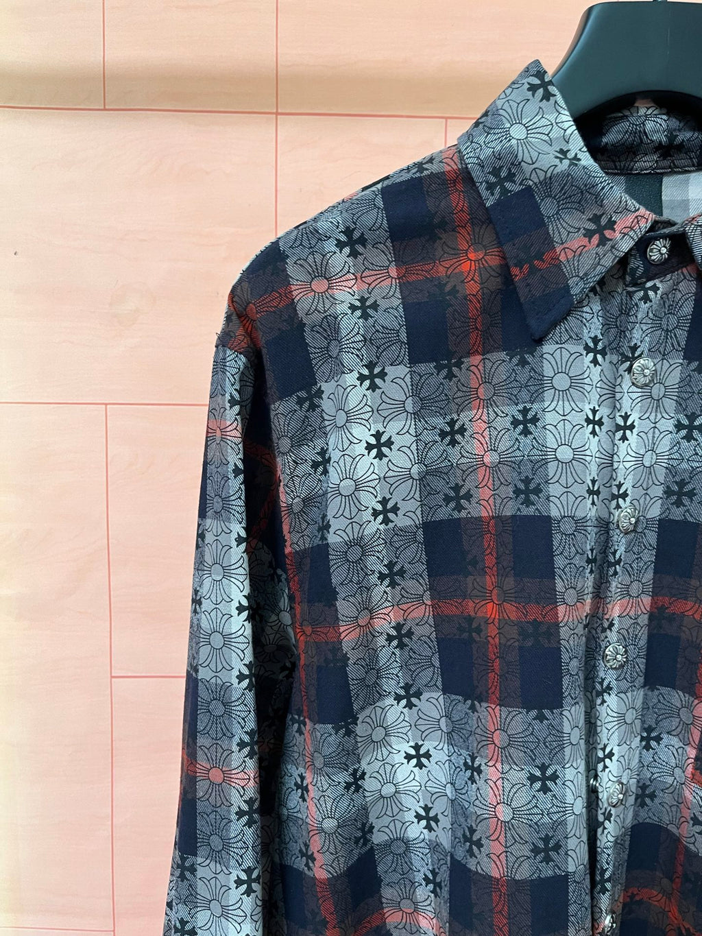 Long-sleeve shirt with light blue floral print and dark plaid with red accents