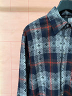 Long-sleeve shirt with light blue floral print and dark plaid with red accents