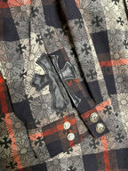 Shirt front placket with buttoned pocket detail and plaid floral print