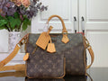 Louis Vuitton monogram duffel bag with tan handles and crossbody strap
