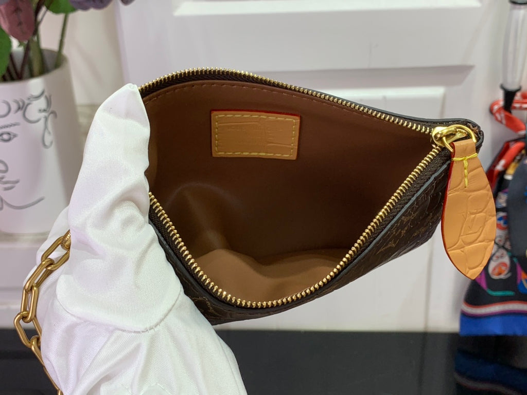 Louis Vuitton duffel bag interior with zip pocket and tan leather trim