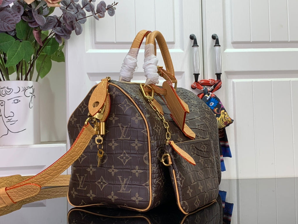 Louis Vuitton monogram duffel bag with side view, tan strap and zip closures