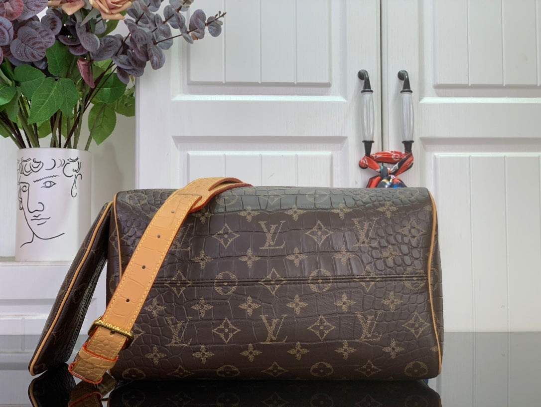 Louis Vuitton monogram duffel bag with tan shoulder strap and zip top