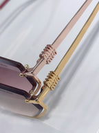 Miu Miu sunglasses close-up of gold-tone hinges and pink temple arms