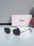 Gold metal hexagonal sunglasses with dark blue lenses and slim blue temples