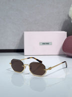Gold metal hexagonal sunglasses with dark brown lenses and tortoiseshell temples