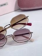 Hexagonal sunglasses side view with pink and brown tinted lenses on gold frames