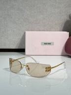 MiuMiu sunglasses with clear lenses, gold frame and pink-gold temples