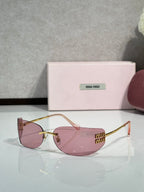MiuMiu sunglasses with pink-tinted lenses, gold frame, light pink temple details