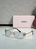 MiuMiu sunglasses with clear lenses, gold frame, black temple tips