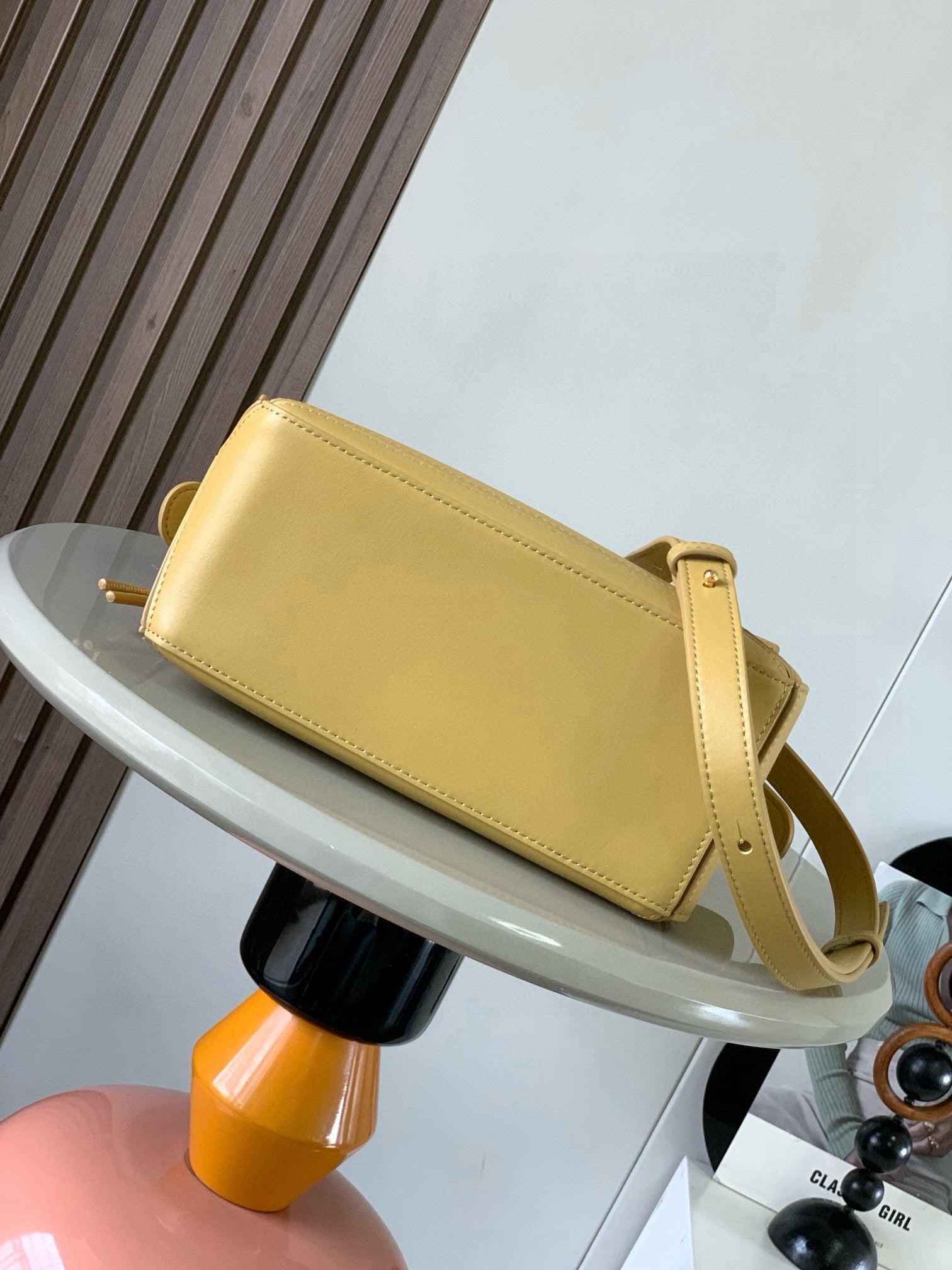 Loewe light yellow leather crossbody bag with top flap and adjustable shoulder strap