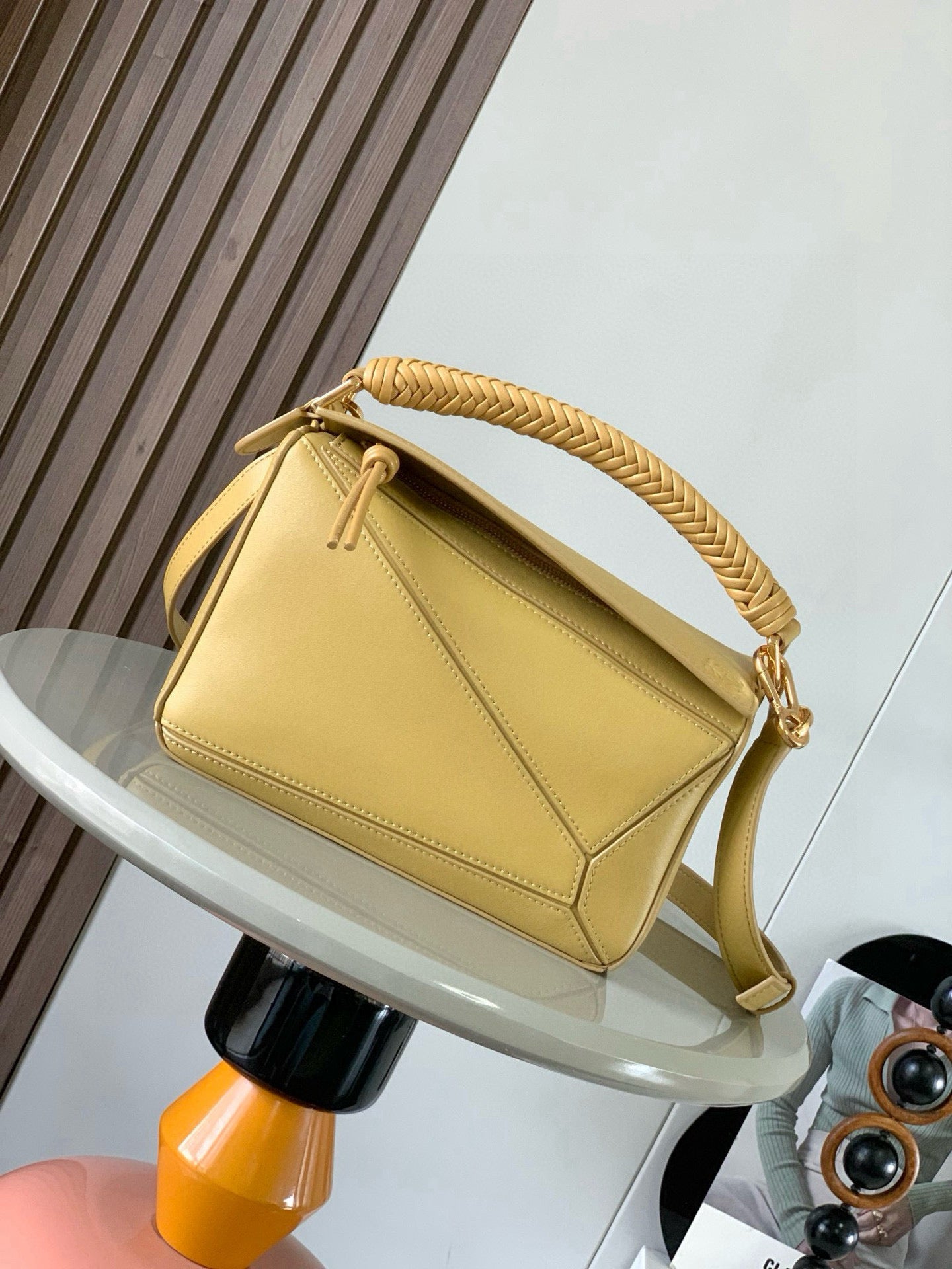 Loewe light yellow leather shoulder bag with braided top handle and gold clasp closure