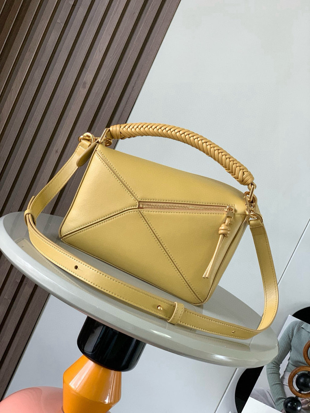 Loewe light yellow leather shoulder bag with braided handle, flap closure, and strap