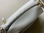 Loewe light blue woven strap detail and top zipper with gold hardware.