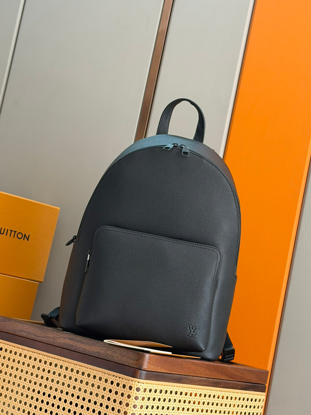 Louis Vuitton leather backpack with top handle and front zipper pocket, dark teal