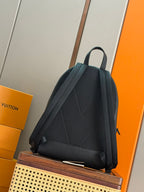 Louis Vuitton leather backpack back view with shoulder straps, dark teal