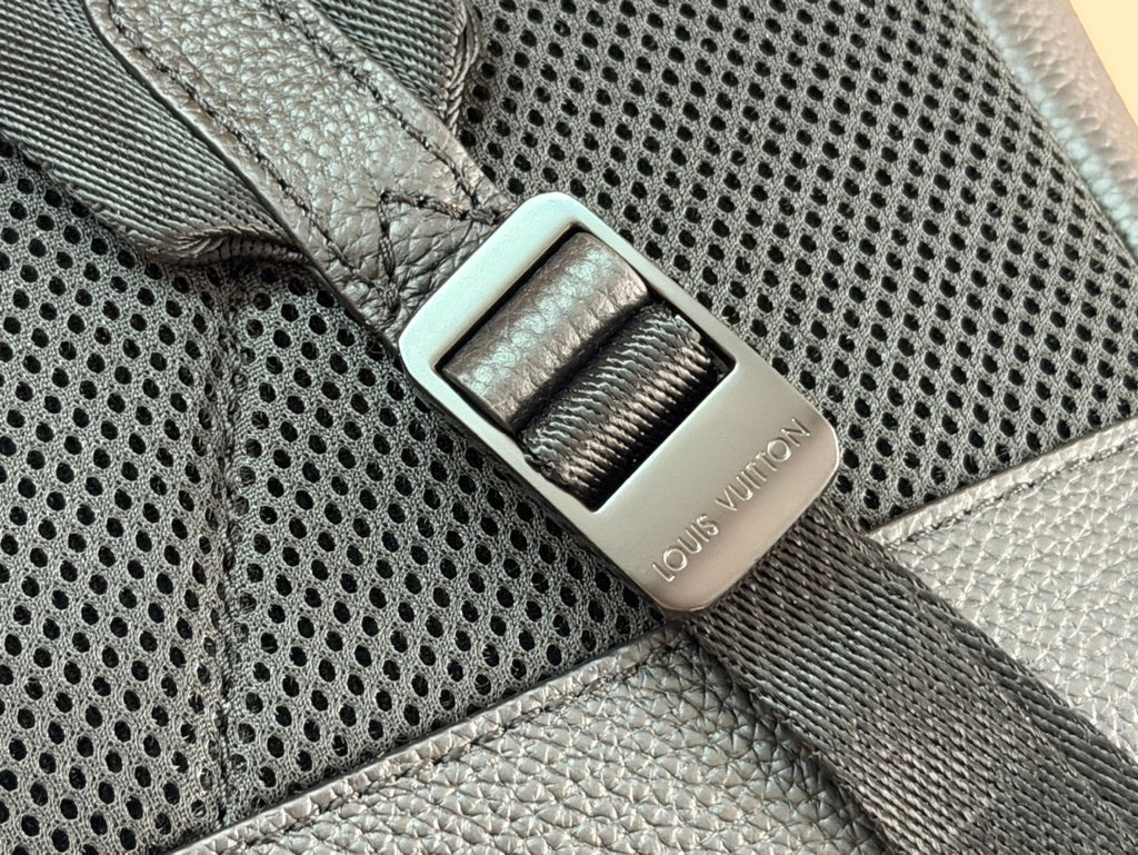 Louis Vuitton leather tag on perforated panel, dark teal